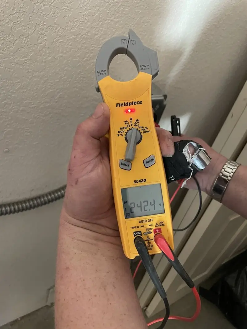 Voltage testing with clamp meter during Outlet Installation in Rockledge